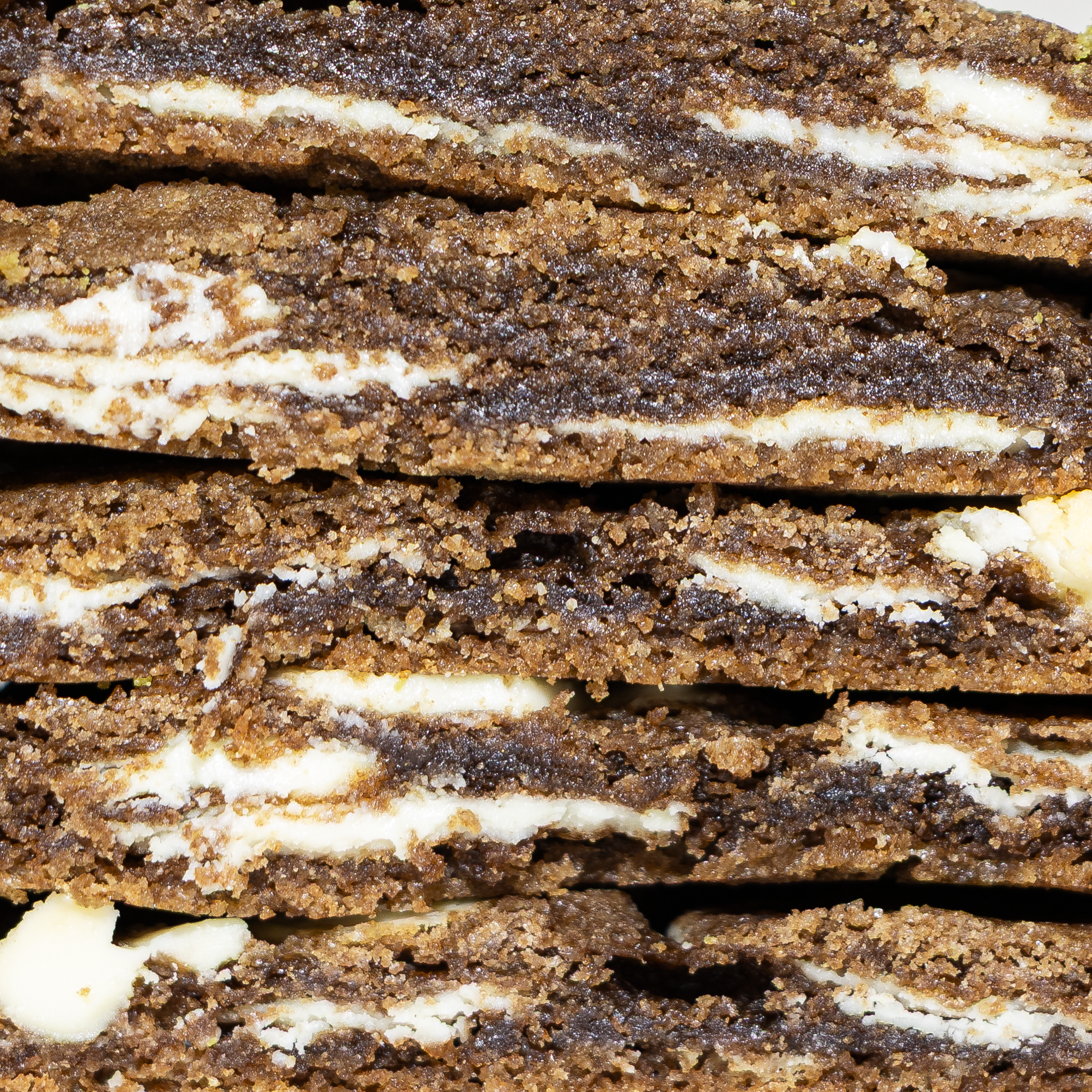 cross section of hojicha cookies showing interior white chocolate