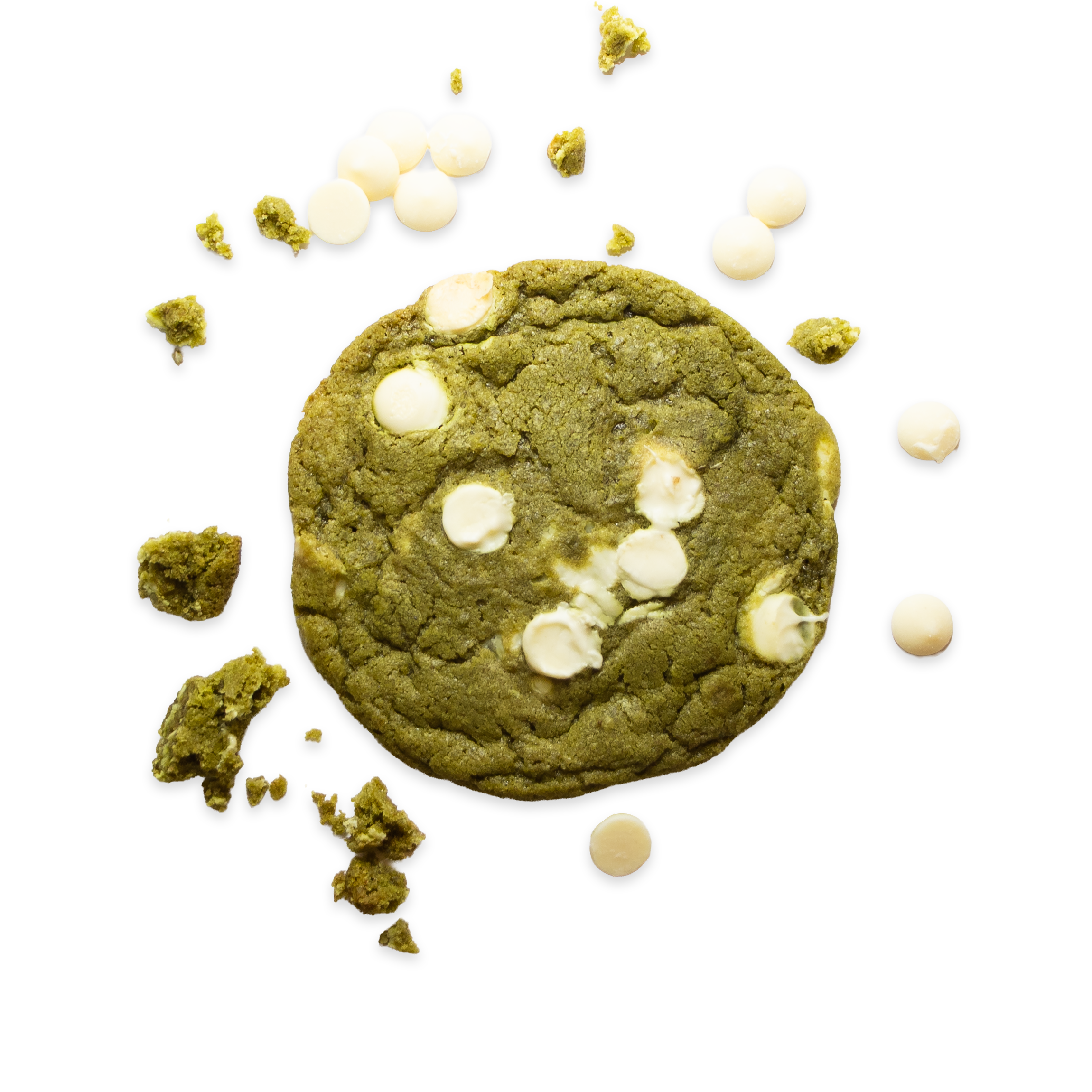 Matcha cookie surrounded by crumbs and white chocolate chunks